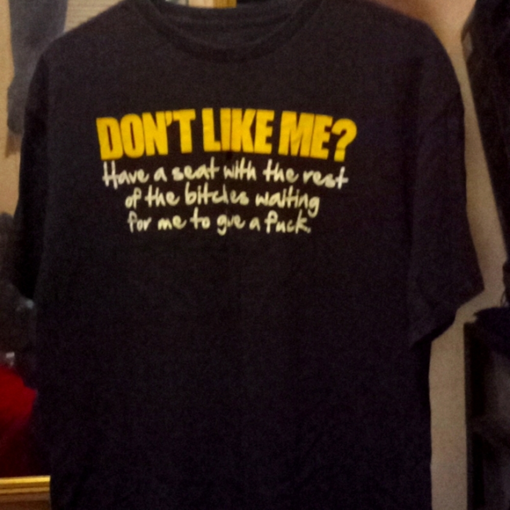 Size L , black with yellow and white writing.